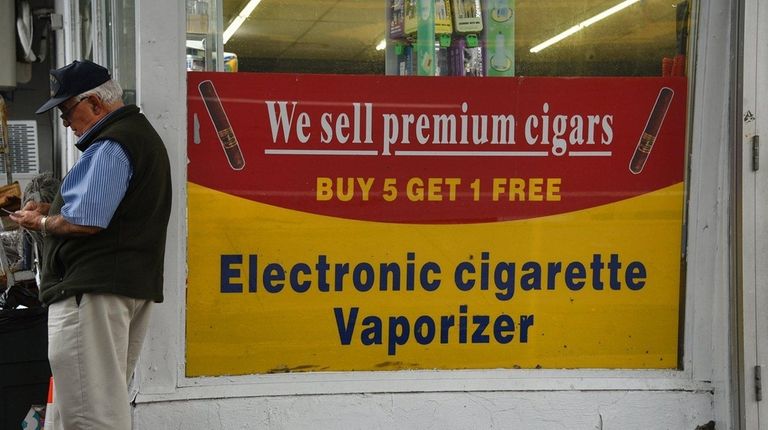 Signs advertising electronic cigarettes, vaporizers, and other tobacco