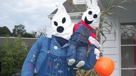 Thirty scarecrows line the paths of Stony Brook