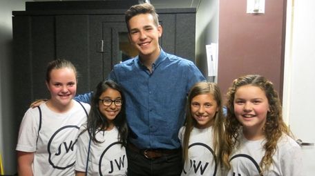 Singer Jacob Whitesides with Kidsday reporters, from left,