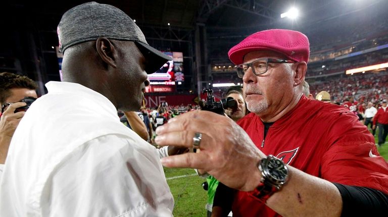 Arizona Cardinals head coach Bruce Arians, right, greets