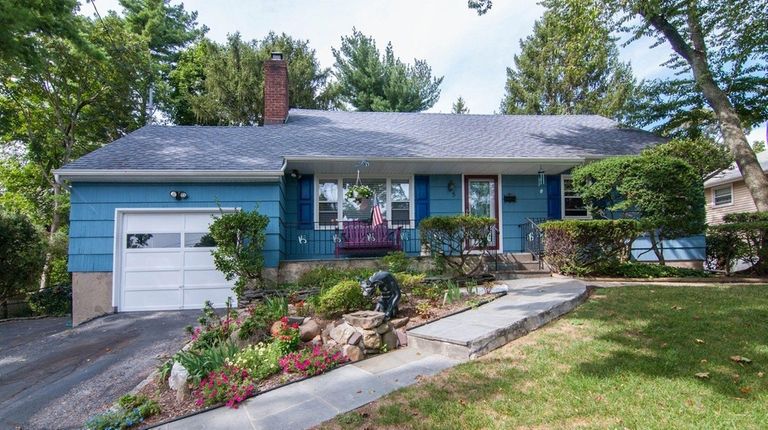 The four-bedroom, two-bath cape is priced at $515,000