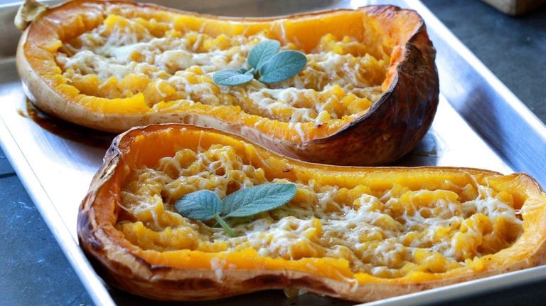 Halved butternut squash is roasted, scooped out, mashed,