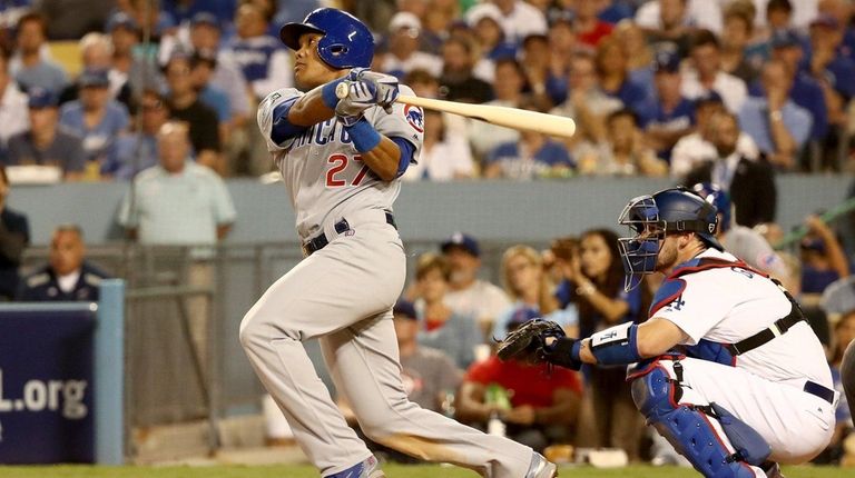 Addison Russell #27 of the Chicago Cubs hits