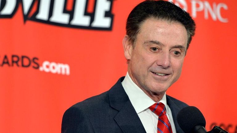 Louisville head basketball coach Rick Pitino answers questions