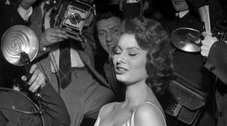 Actress Sophia Loren poses for the photographers at