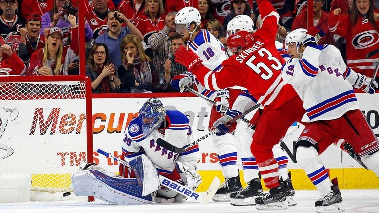 Carolina Hurricanes' Jeff Skinner (53) splits the defense