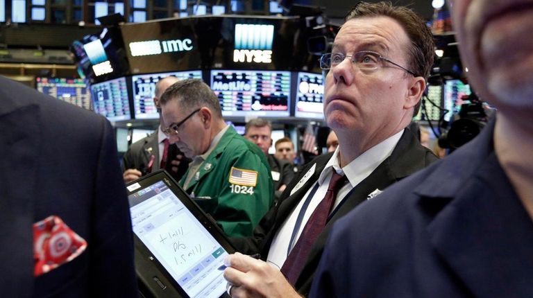 Trader Joseph Murray works on the floor of