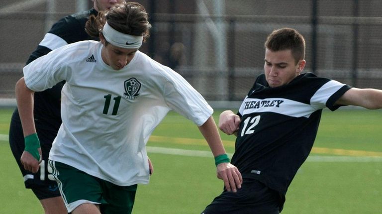 Carle Place's Clay Pines, left, battles against Wheatley's