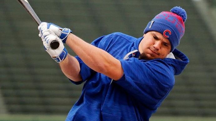 Chicago Cubs' Kyle Schwarber stretches works out during