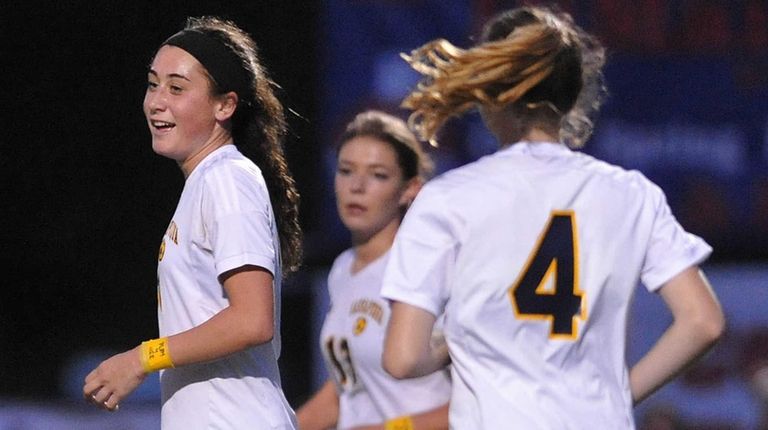 Hope Breslin #11 of Massapequa reacts after scoring