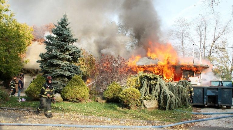 About 70 firefighters battled flames on Wednesday, Nov.