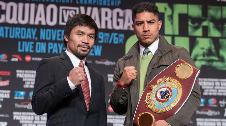 Boxers Manny Pacquiao, left, and Jessie Vargas pose