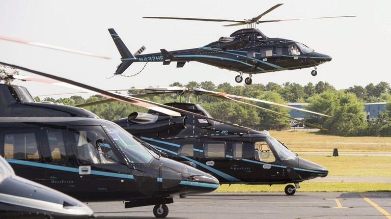 A helicopter arrives at East Hampton Town Airport