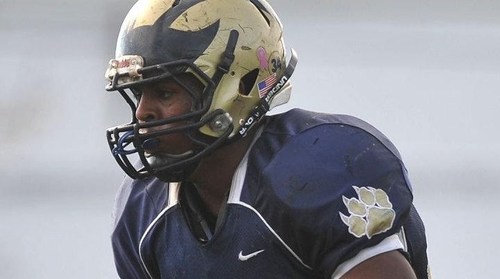 Johnathan Debique #34 of Baldwin rushes into the