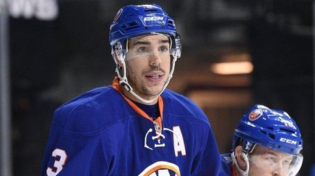 New York Islanders defenseman Travis Hamonic looks on
