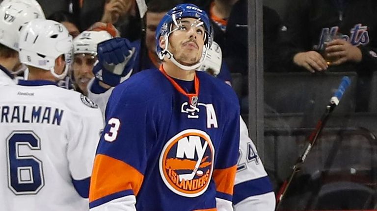 New York Islanders defenseman Travis Hamonic reacts after