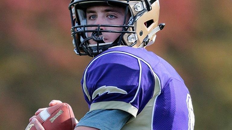 Sayville quarterback Jack Coan (9) warms up before