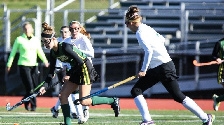 Ward Melville's Kate Mulham (4) moves the ball