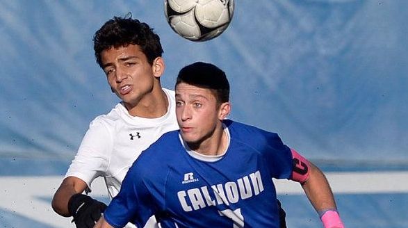 Calhoun's Eric Stewart tries to settle the ball
