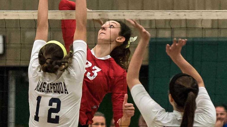 Connetquot's Cassandra Patsos (23) spikes the ball during