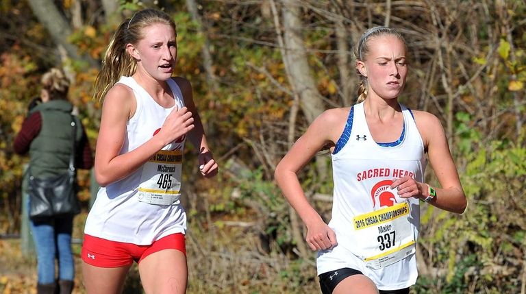 Maggie Maier of Sacred Heart runs during the