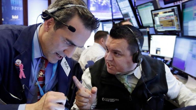 Traders Gregory Rowe, left, and Robert Finnerty on