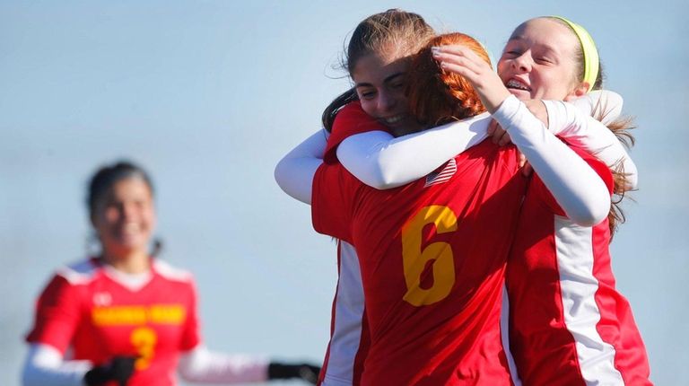 Sacred Heart Academy players celebrate the first goal