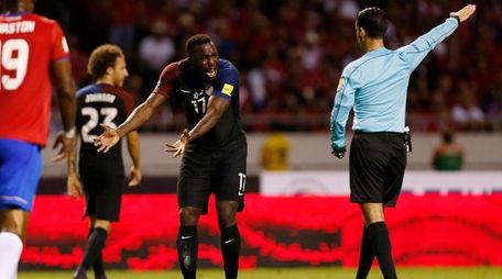The United States' Jozy Altidore, center, protests to