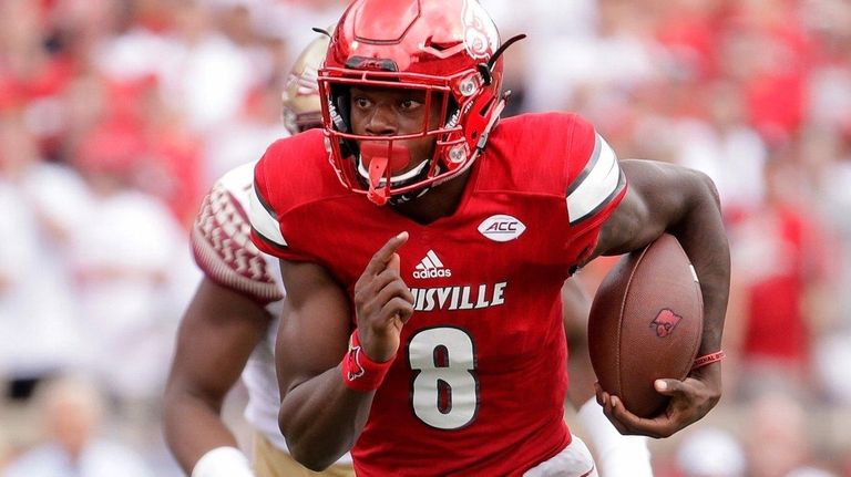 Louisville's Lamar Jackson runs for a touchdown against
