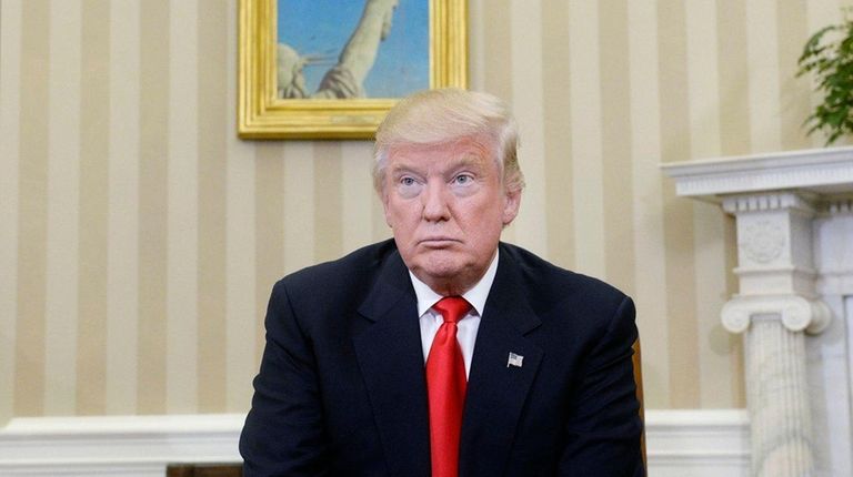 President-elect Donald Trump looks on in the Oval