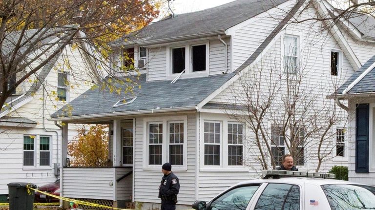 Police investigate a fire at 55 Roger Place