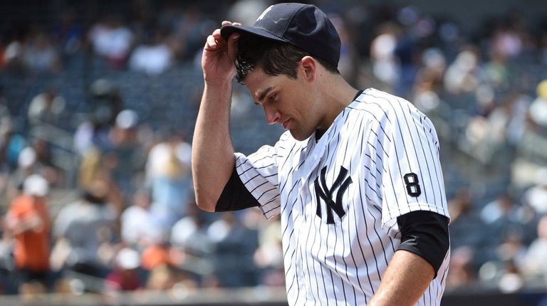 New York Yankees starting pitcher Nathan Eovaldi walks