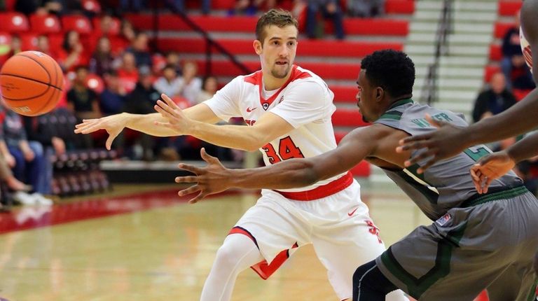 Stony Brook's Lucas Woodhouse passes during 71-70 loss