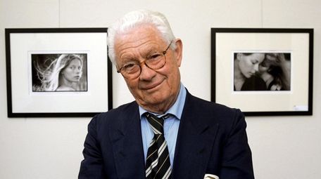 British photographer David Hamilton is shown in front