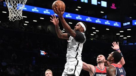 Brooklyn Nets forward Trevor Booker sinks a layup