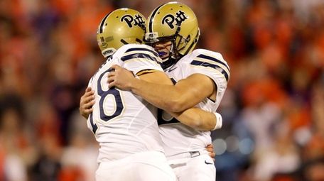 Chris Blewitt celebrates with teammate Ryan Winslow of