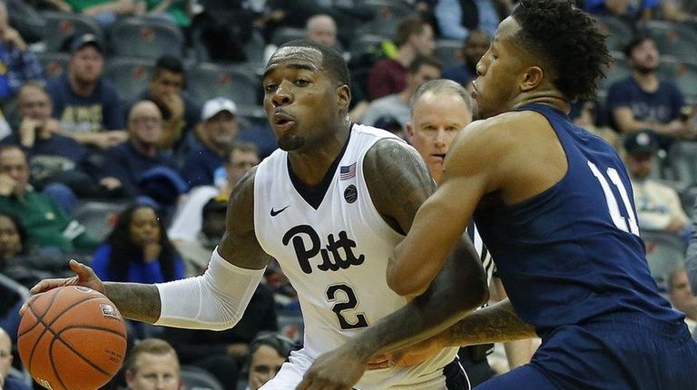 Michael Young #2 of the Pittsburgh Panthers drives