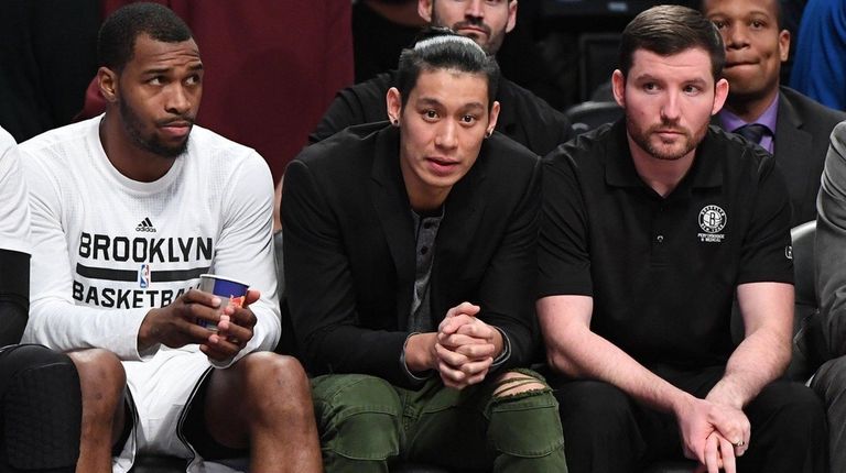 Brooklyn Nets guard Jeremy Lin looks on from