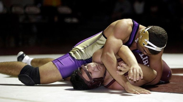 Central Islip's Malachi Lord Kelly pins Whitman's Luis