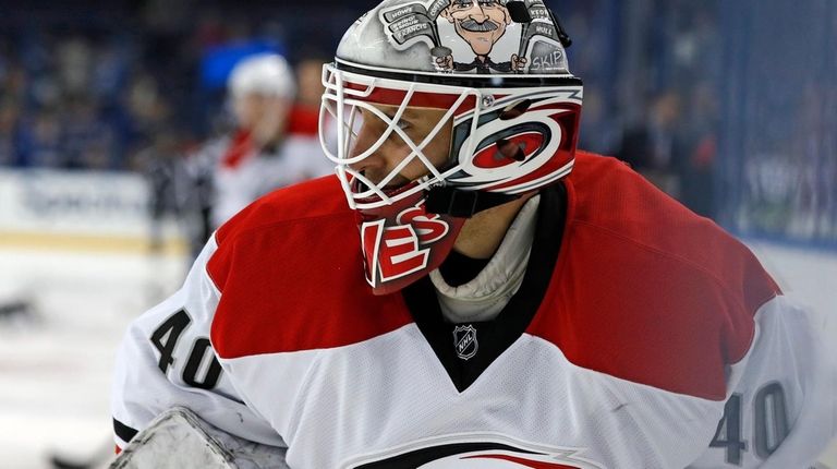Carolina Hurricanes equipment manager Jorge Alves warms up
