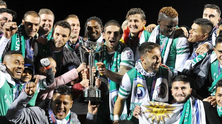 Members of the New York Cosmos celebrate with