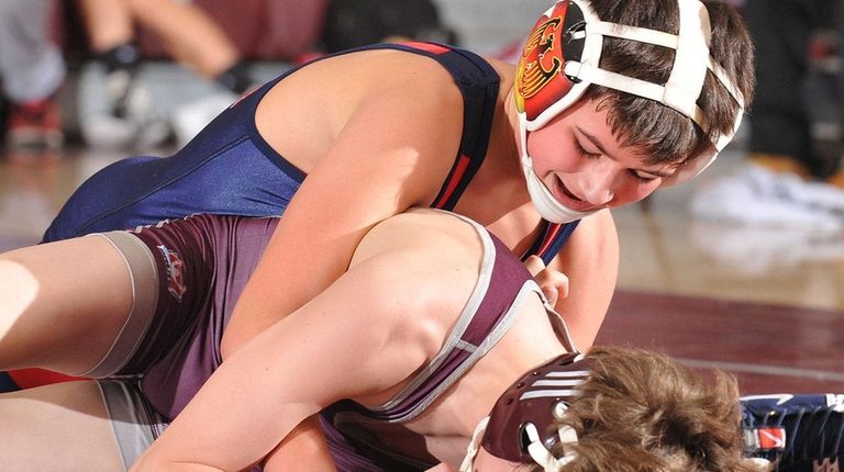 MacArthur's Jake Schneider, top, controls Mepham's Greg Gibbons