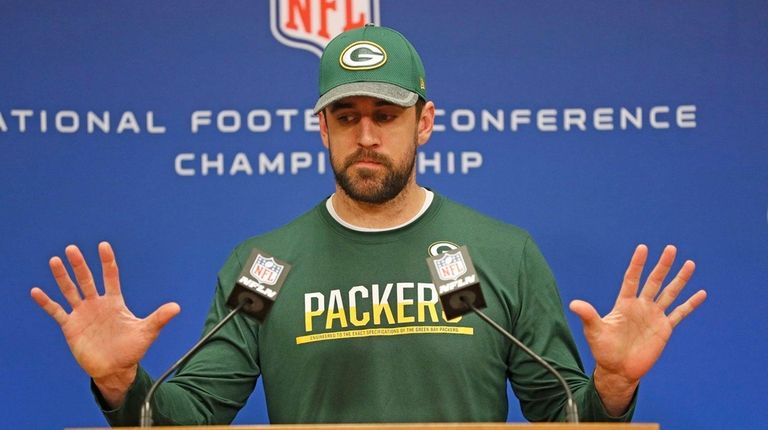 Green Bay Packers quarterback Aaron Rodgers speaks with