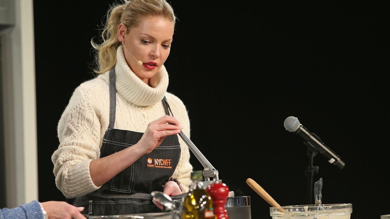 Actress Katherine Heigl cooks on stage during the. 