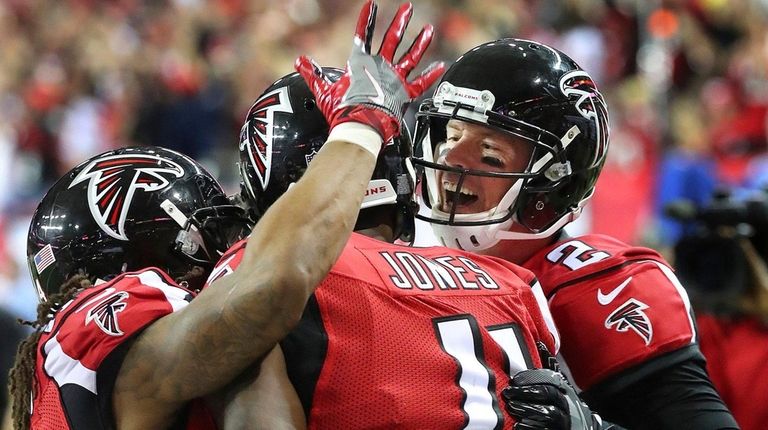 Atlanta Falcons quarterback Matt Ryan, right, and running