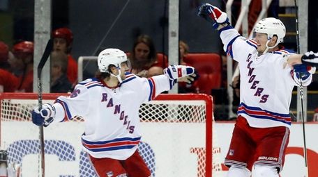 New York Rangers' J.T. Miller, right, celebrates with