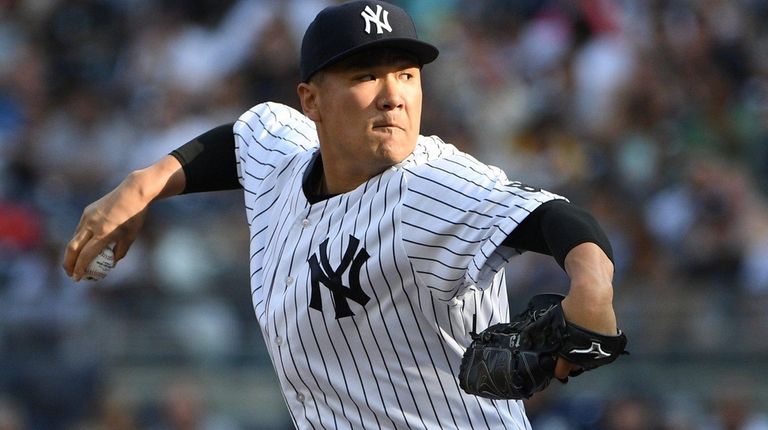 New York Yankees starting pitcher Masahiro Tanaka delivers