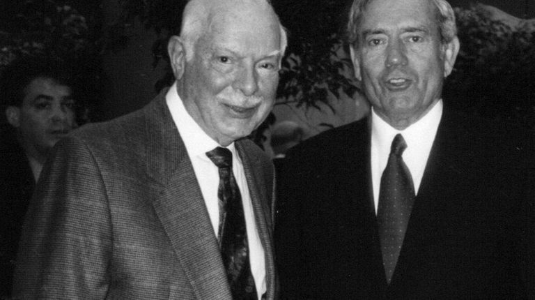 This November 2000 photo shows Bernard Redmont, left,