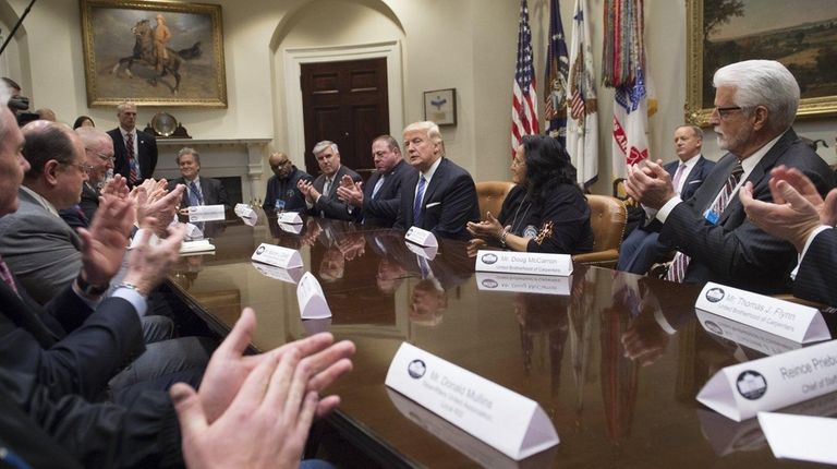Union leaders applaud President Donald Trump as he