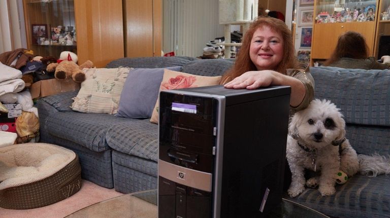 Alita Ditkowsky with her broken computer, which was